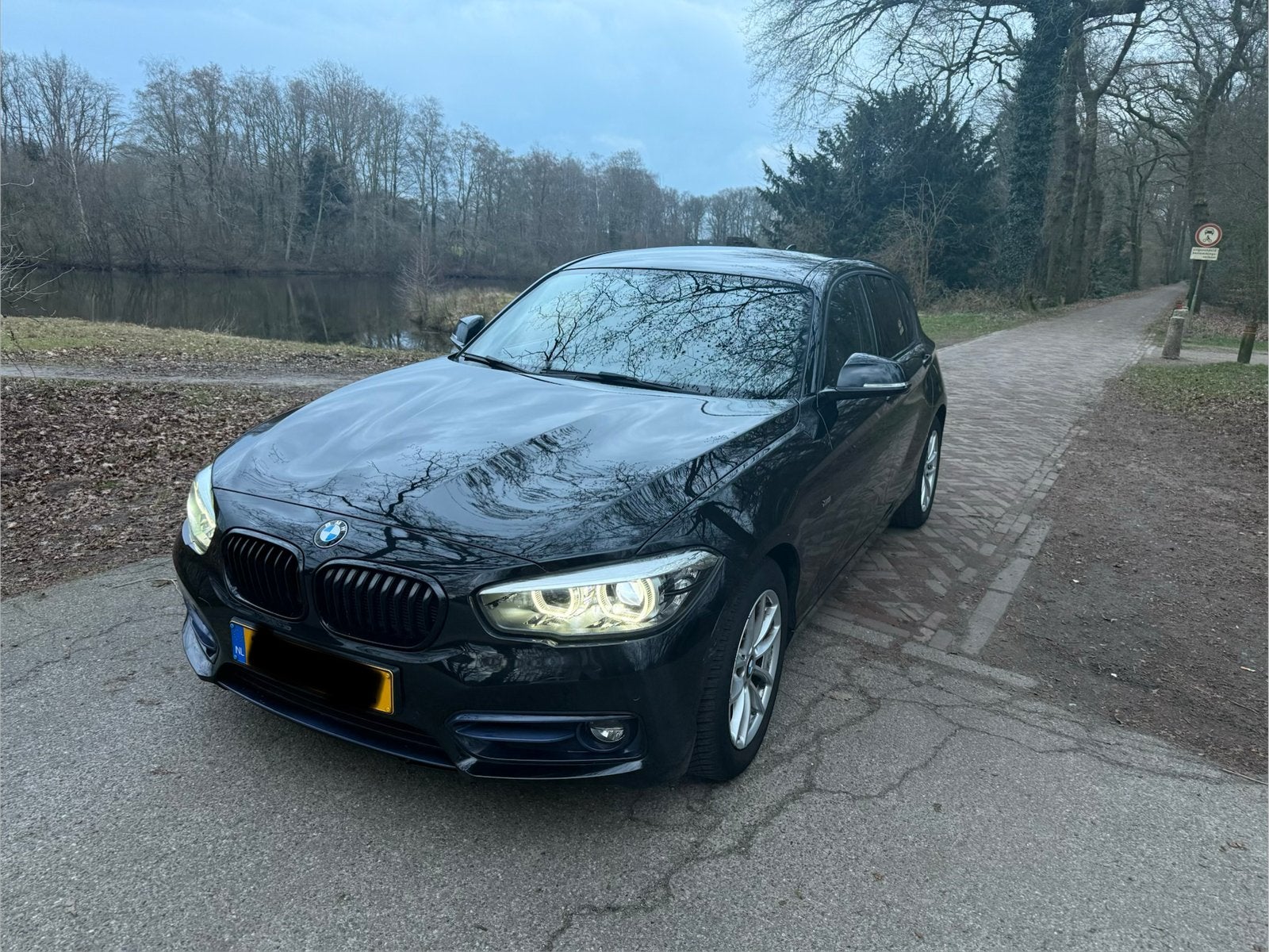 BMW 1-Serie 116i 109pk 2018 Zwart, Auto's, BMW, 1-Serie, Achterwielaandrijving, 1280 kg, Zwart