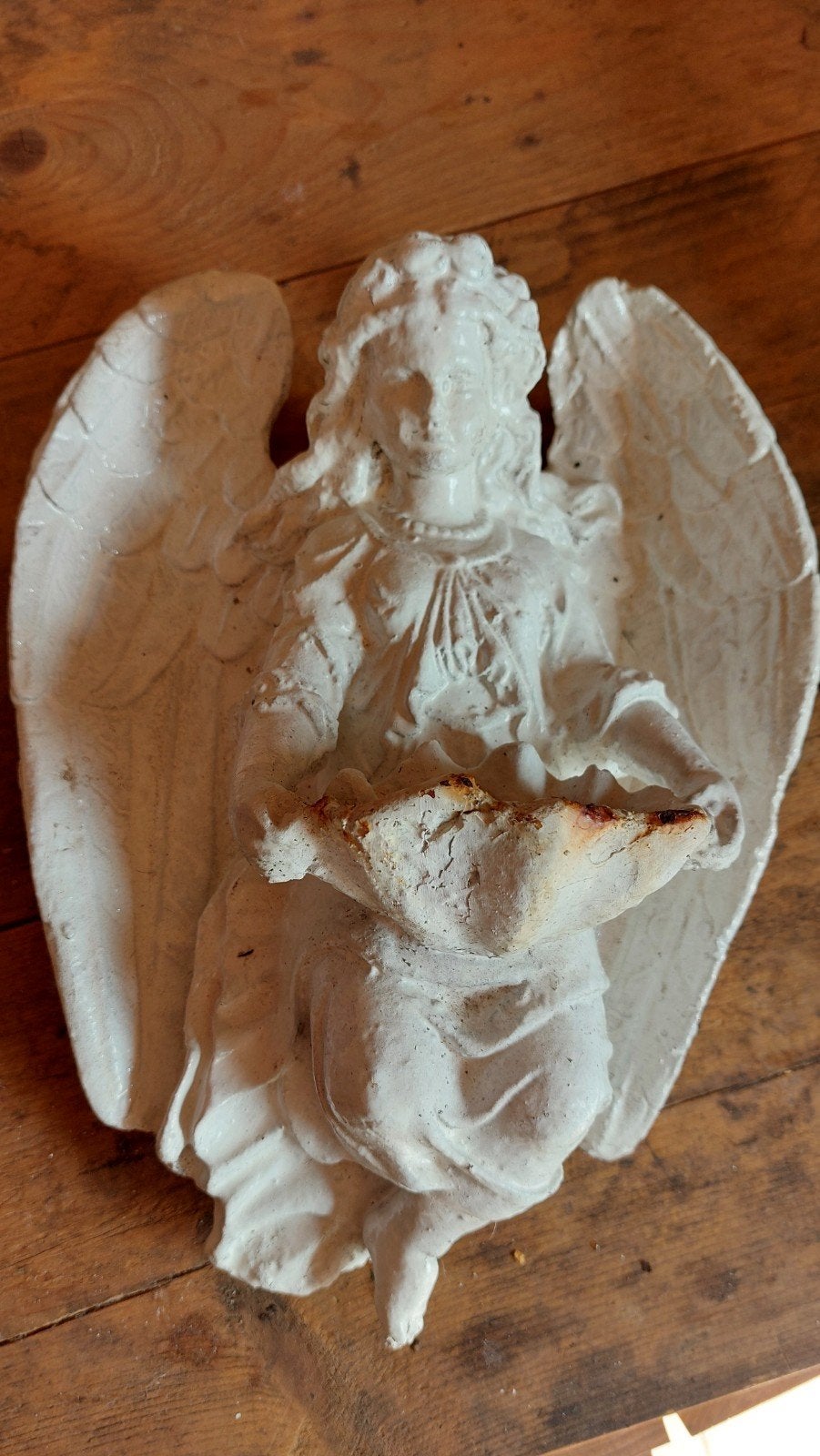Gietijzeren engel muurbeeld, Ophalen