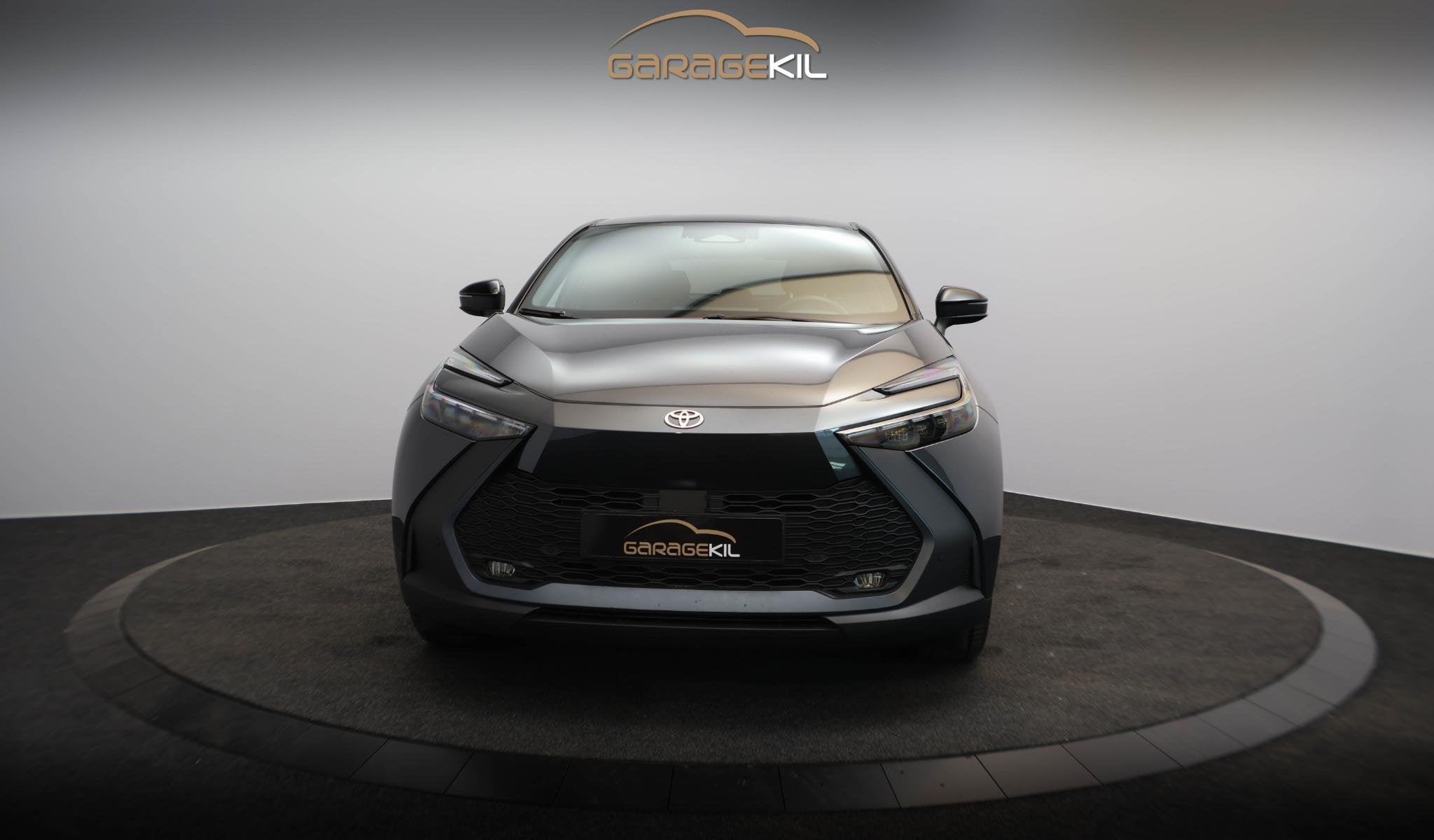 Toyota C-HR 1.8-l-VVT-i Hybrid Team Deutschland Dealerdonder, Stof, Zwart, 4 cilinders, Bedrijf