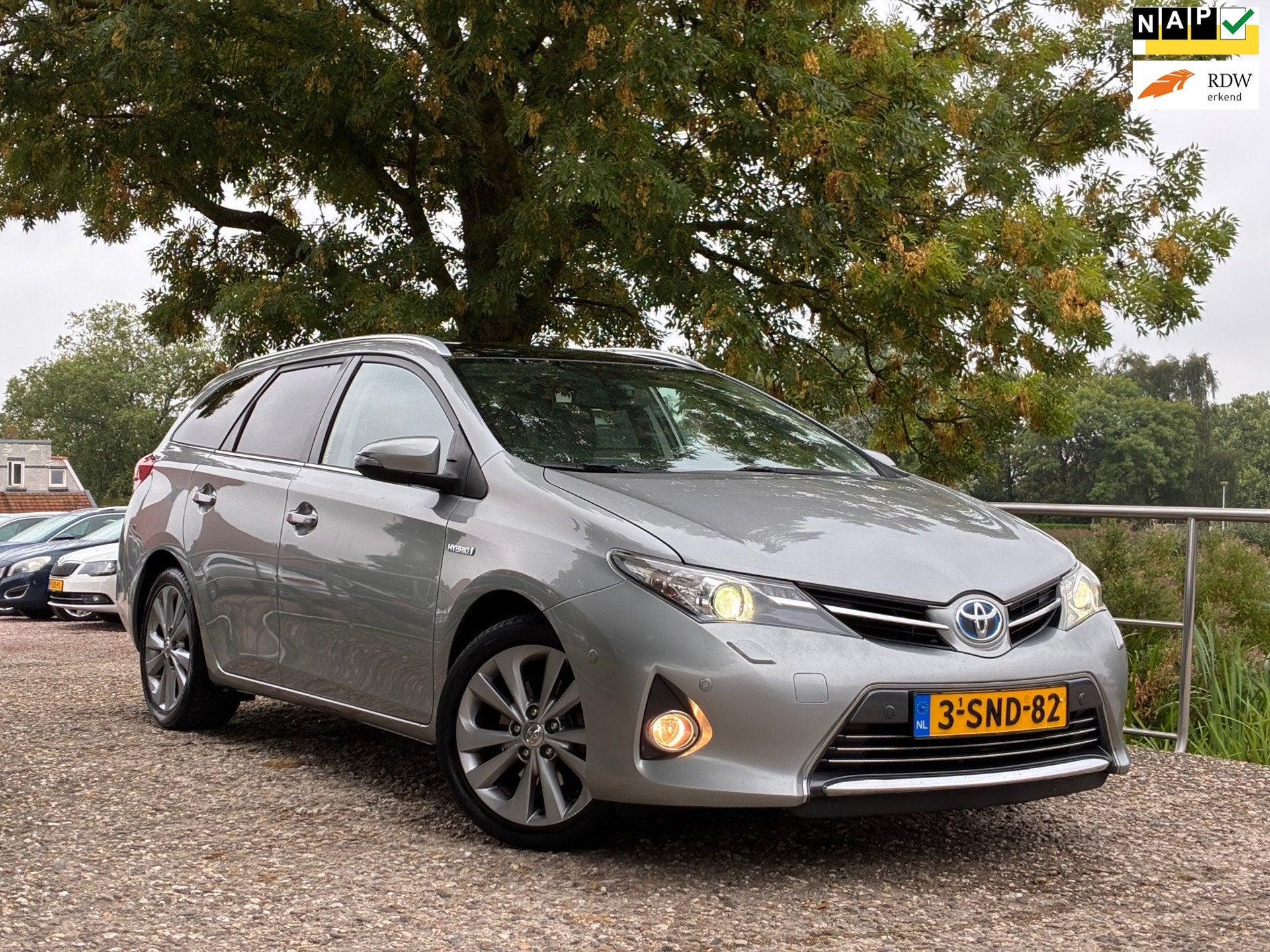 Toyota Auris Touring Sports 1.8 Hybrid Lease Pro | Panodak +, Auto's, Toyota, Euro 5, Gebruikt, Zwart, Leder en Stof