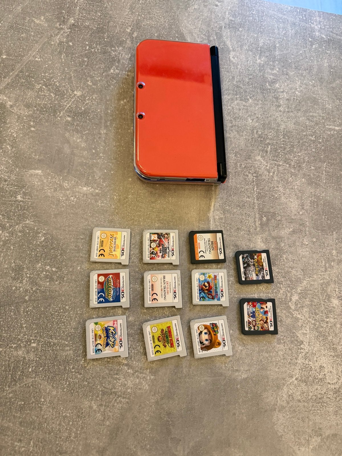 New Nintendo 3DS XL Oranje met 9 spellen, Spelcomputers en Games, Spelcomputers | Nintendo 2DS en 3DS, 3DS XL, Ophalen of Verzenden