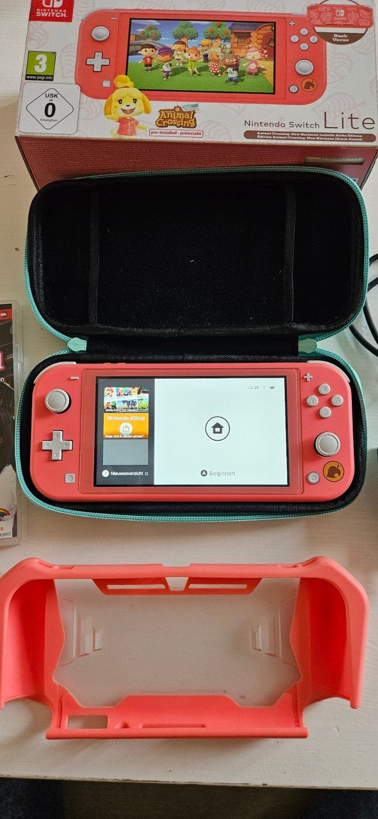Nintendo Switch Lite Koraalrood met Animal Crossing en game, Met games, Ophalen of Verzenden, Zo goed als nieuw, Zonder controller