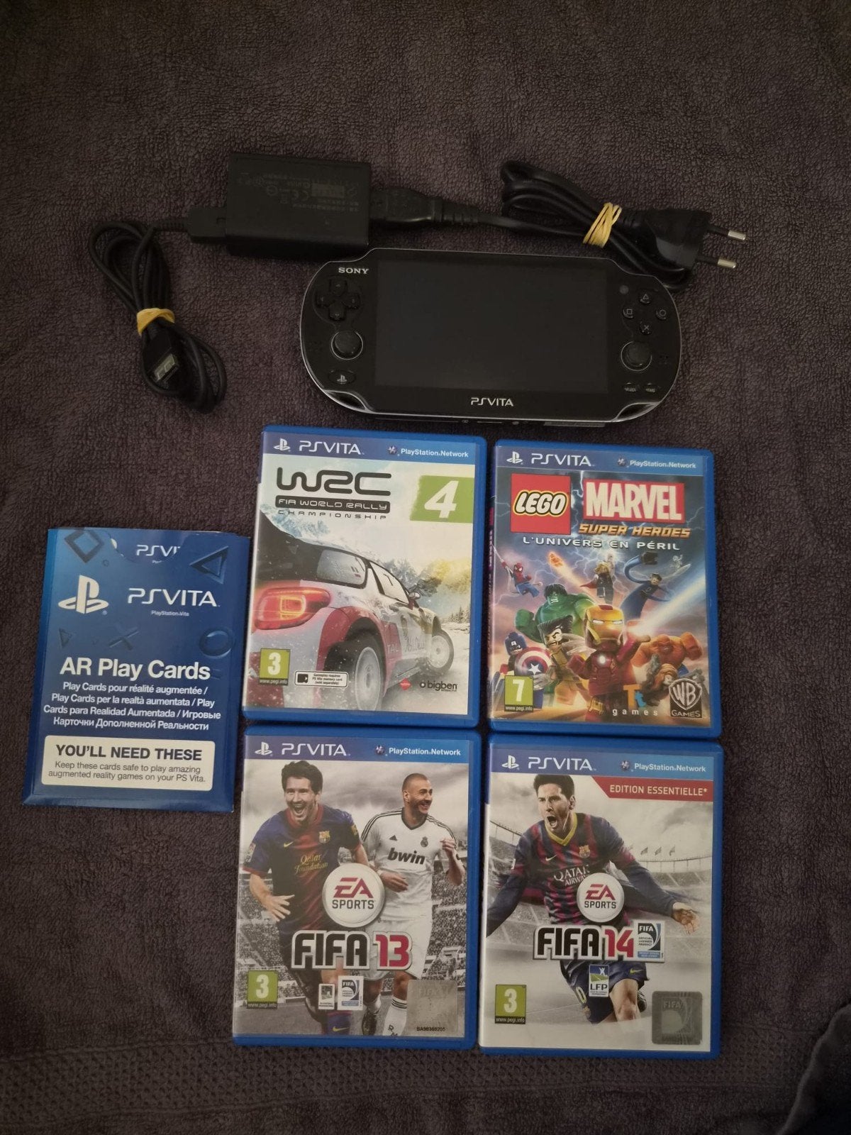Sony PS Vita PCH-1004 met 4 games en oplader, Ophalen of Verzenden, Zo goed als nieuw