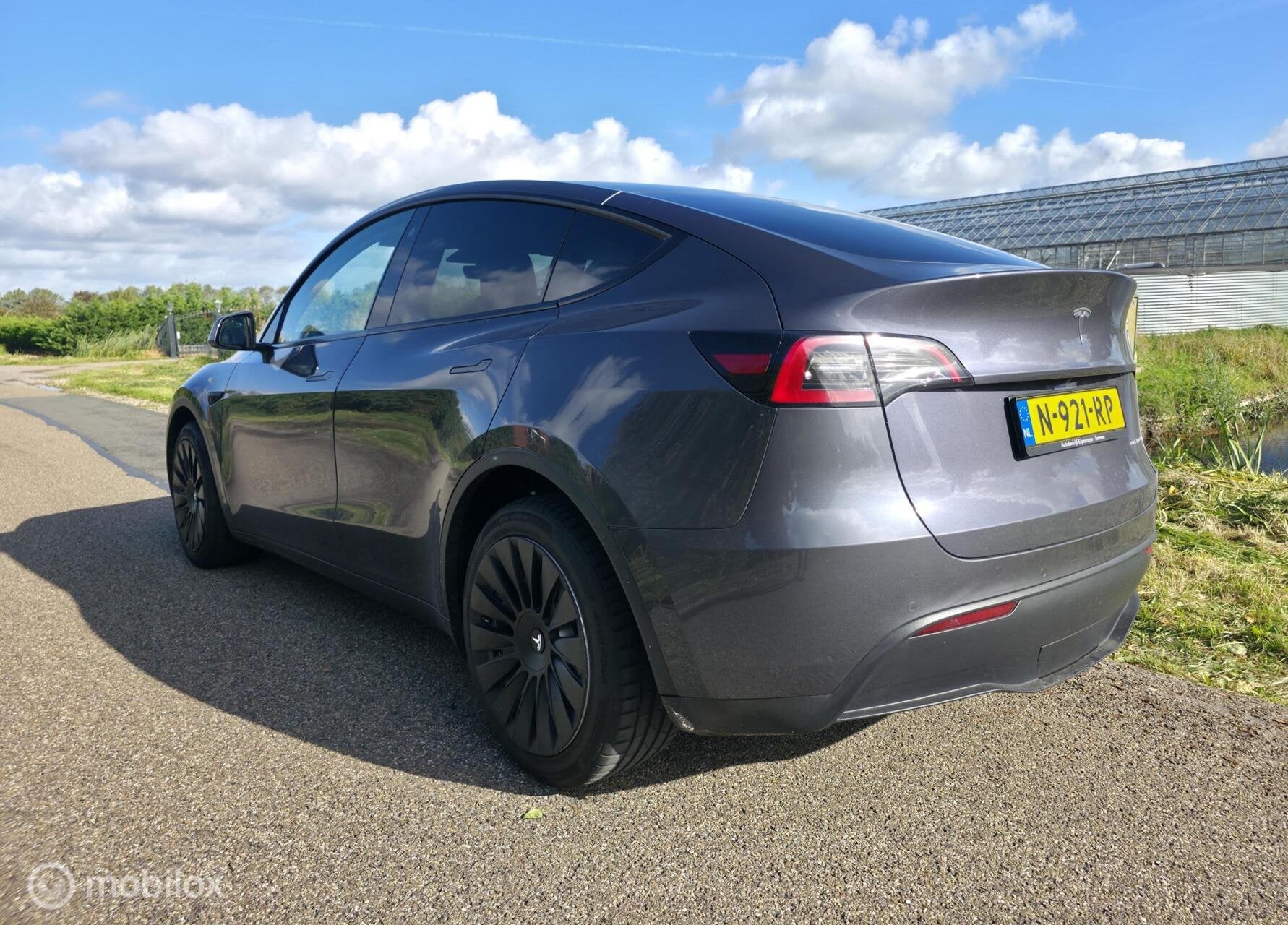Tesla Model Y Long Range AWD 75 kWh / Trekhaak / Leder, Automaat, Gebruikt, Zwart, Verwarmde buitenspiegels