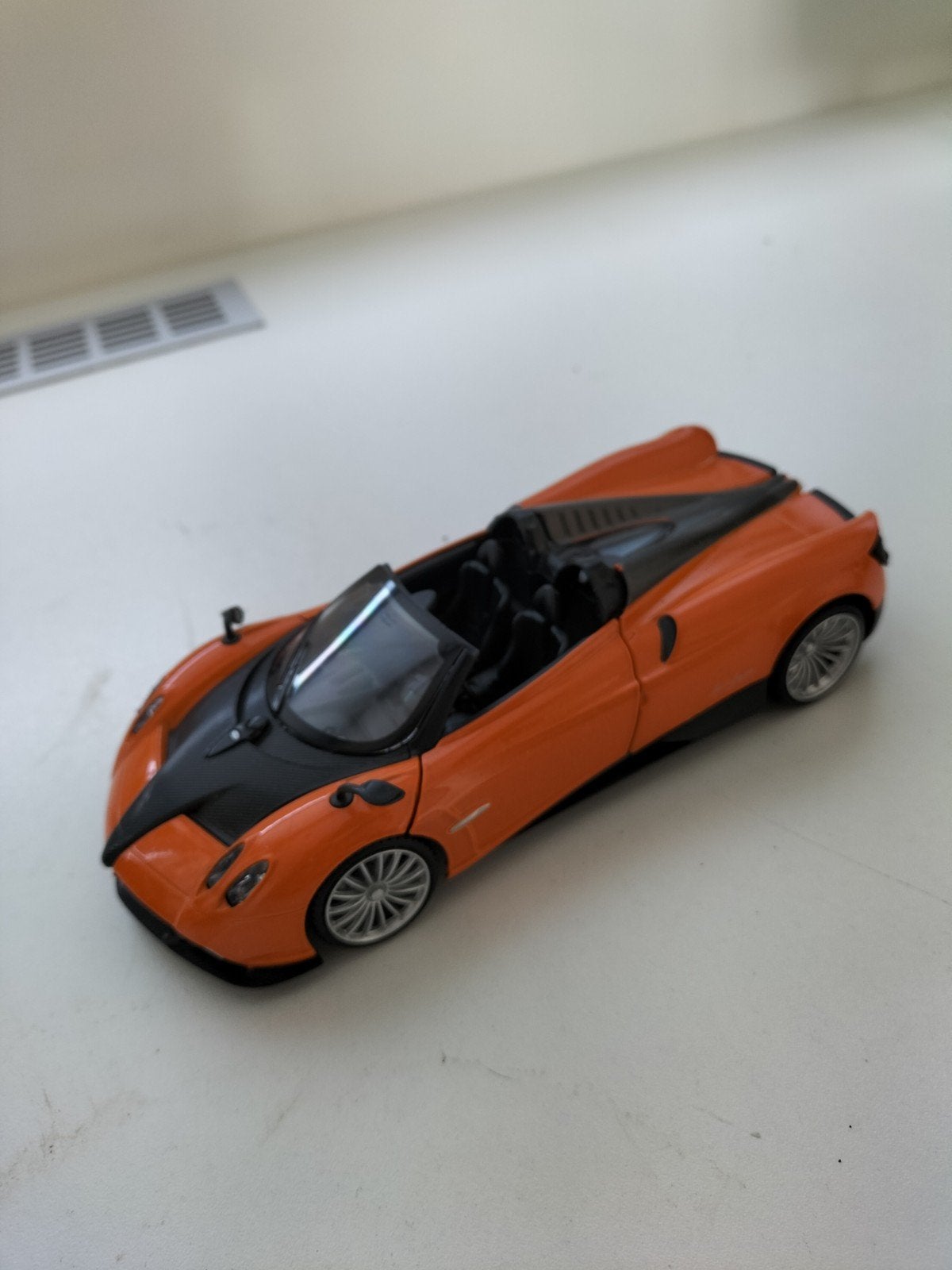 Pagani Huayra Roadster modelauto 1:24 oranje, Verzenden, Zo goed als nieuw