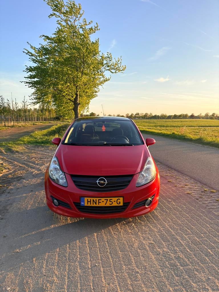 Opel Corsa 2009 Rood, Auto's, Voorwielaandrijving, Stof, USB, Zwart