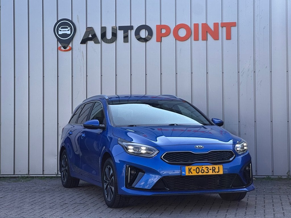 Kia Ceed Sportswagon 1.6 GDI PHEV Dynamic+Line 1E EIG ORG NL, Auto's, Kia, 8 kWh, Gebruikt, Blauw, Leder en Stof