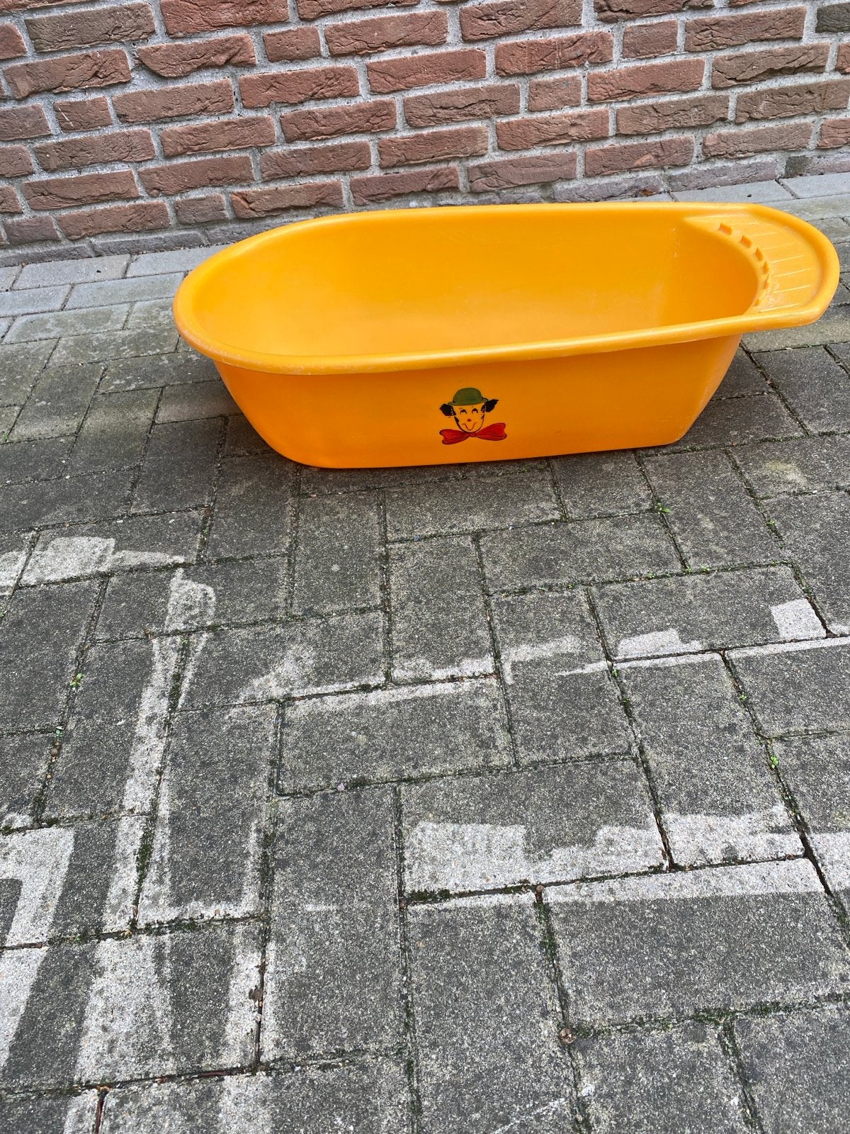 Oranje babybadje met vrolijke opdruk, Ophalen of Verzenden, Gebruikt, Badje, Overige merken