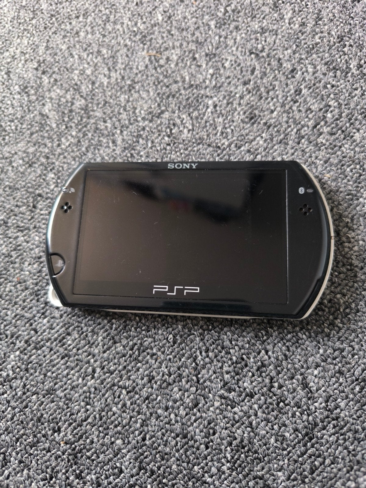 Sony PSP N1001 met 8 games en USB-datakabel, Spelcomputers en Games, Zwart, Ophalen of Verzenden, PSP Go, Gebruikt