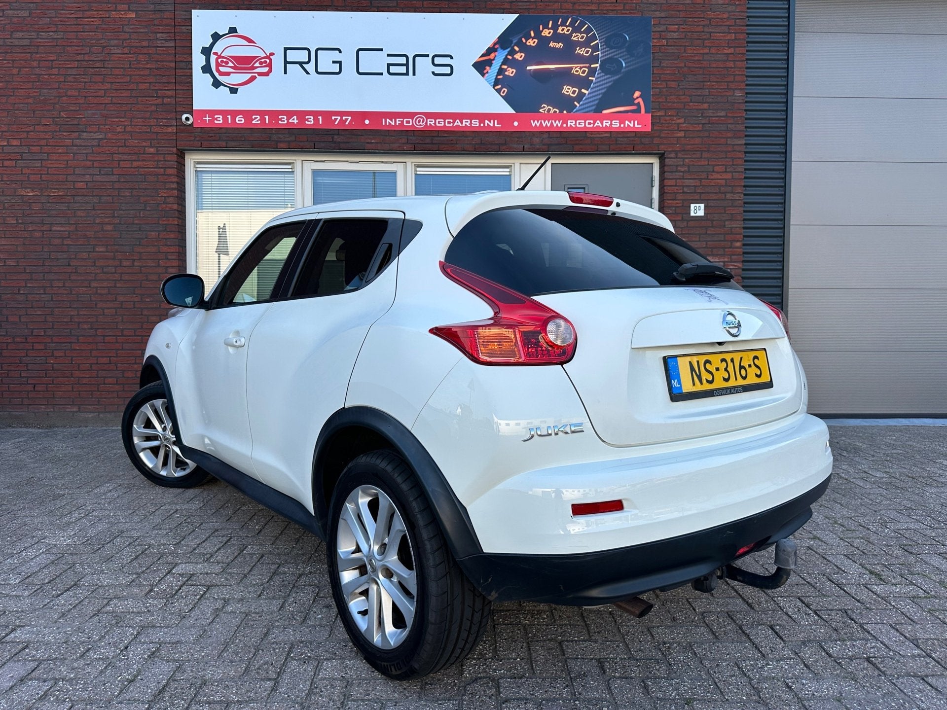 Nissan Juke 1.6 Tekna / AUT / Navi / Camera / Clima / Stoelv, Auto's, Euro 5, 4 cilinders, Met garantie (alle), Wit