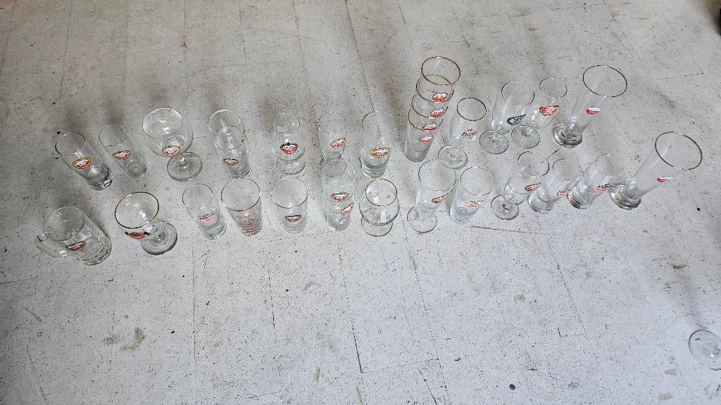 29 Verschillende Amstel glazen, Ophalen, Zo goed als nieuw, Glas of Glazen, Amstel