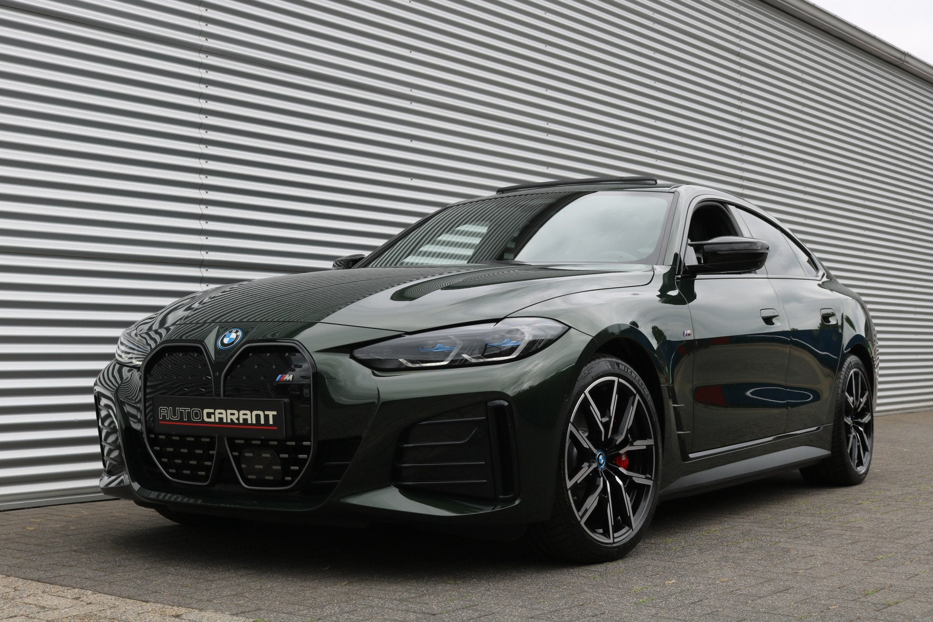 BMW i4 M50 High Executive 84 kWh 544PK (Schuifdak Sportleder, Auto's, BMW, 12 maanden, Gebruikt, Zwart, Leder