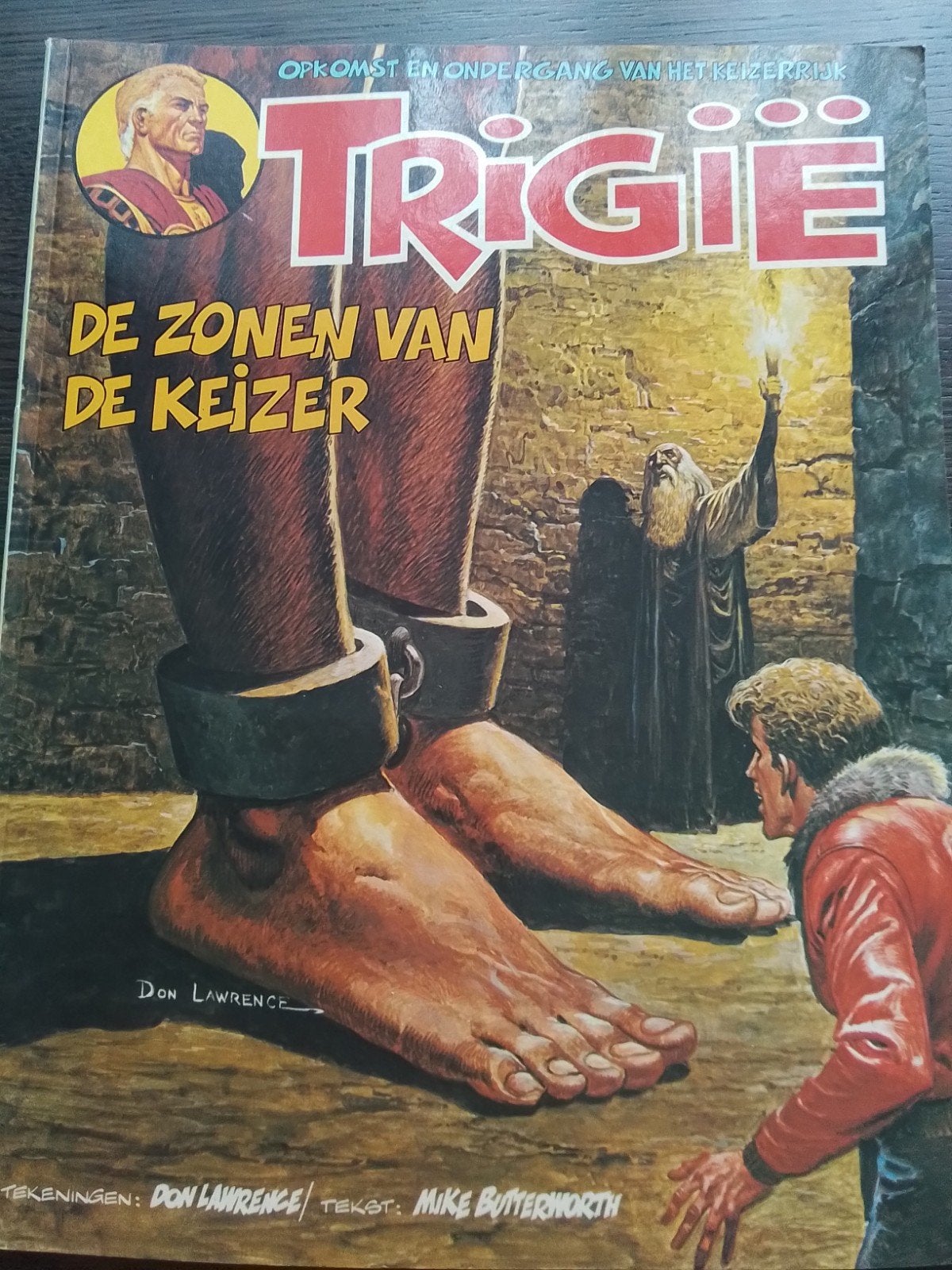 Trigië De zonen van de Keizer, Gelezen, Ophalen of Verzenden, Don Lawrence, Mike Butterworth, Eén stripboek