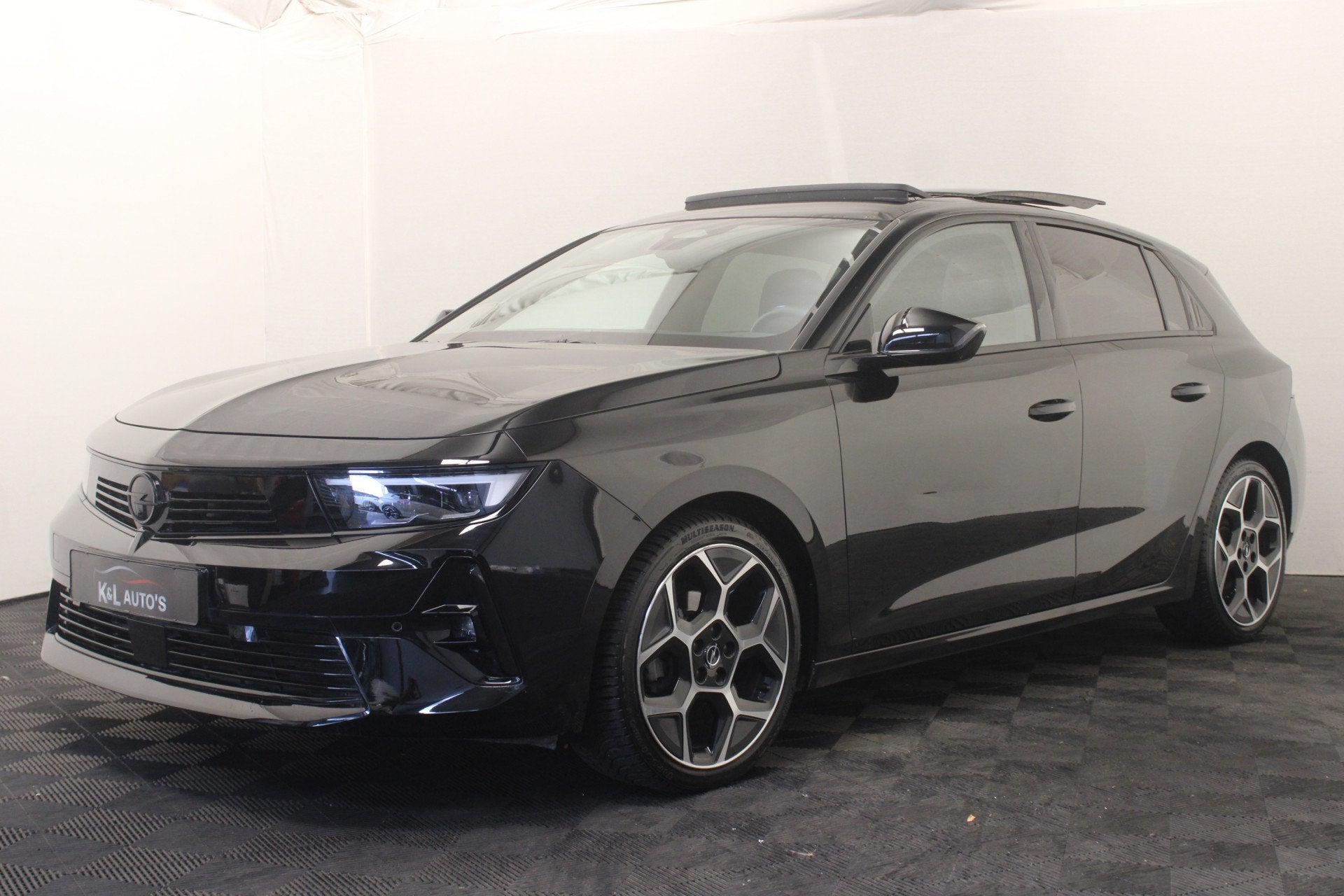 Opel Astra 1.2 Turbo Ultimate |Pano|Stoel/stuur verw.|Camera, Gebruikt, Zwart, 1199 cc, Zwart
