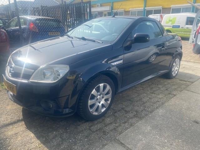 Opel Tigra TwinTop 1.4-16V Linea Rosso, Auto's, Opel, Gebruikt, 4 cilinders, Cabriolet, 1389 cc
