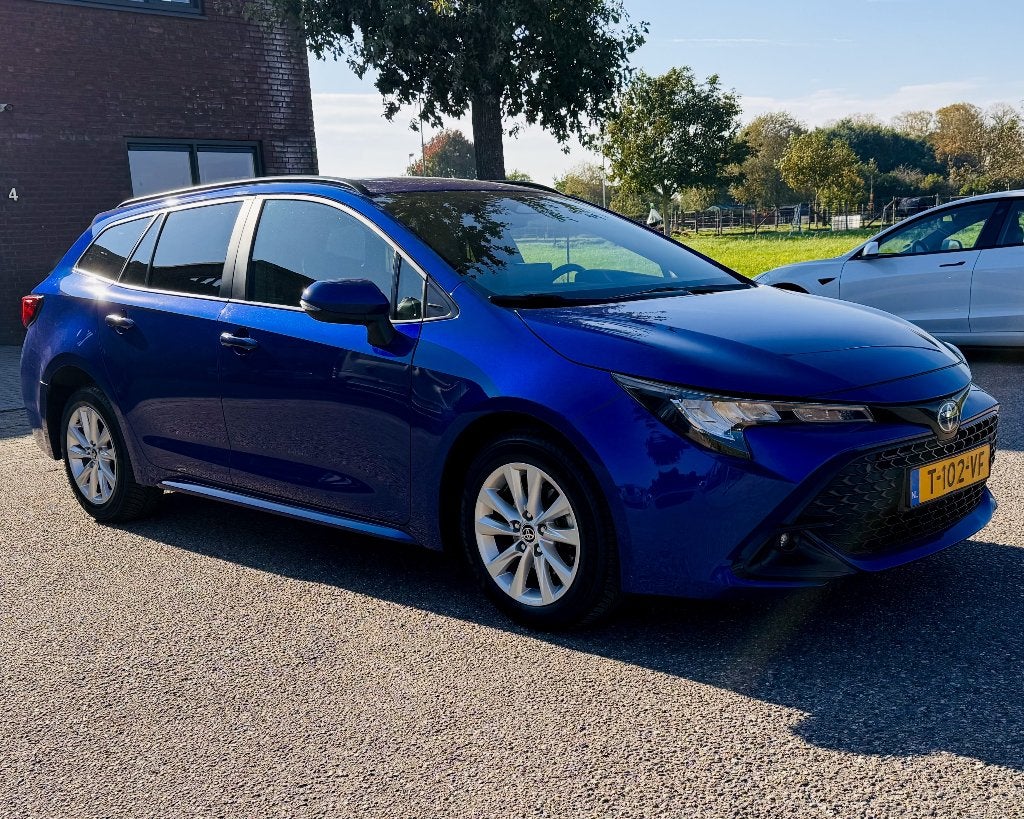 Toyota Corolla TS Hybrid 140 Business | FACELIFT, Auto's, 4 cilinders, Blauw, Corolla, Hybride Elektrisch/Benzine