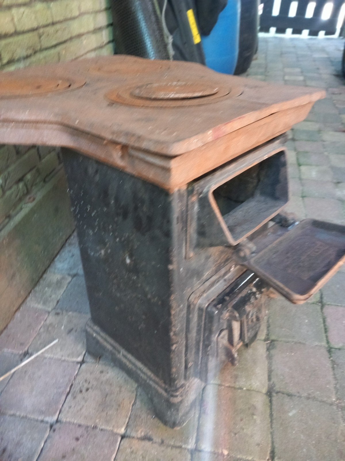 oude hout kachel met poets werk, Ophalen