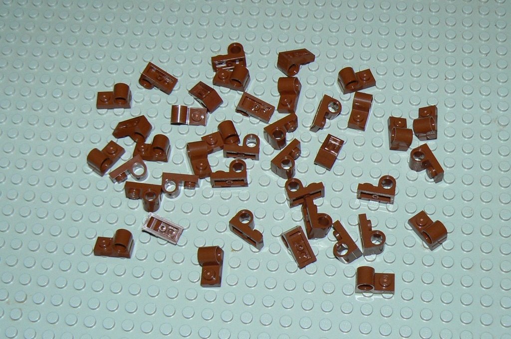 L1008 Technic plaatje 1x2 gat voor pin (boven) roodbruin 40, Lego, Nieuw, Ophalen of Verzenden, Technic