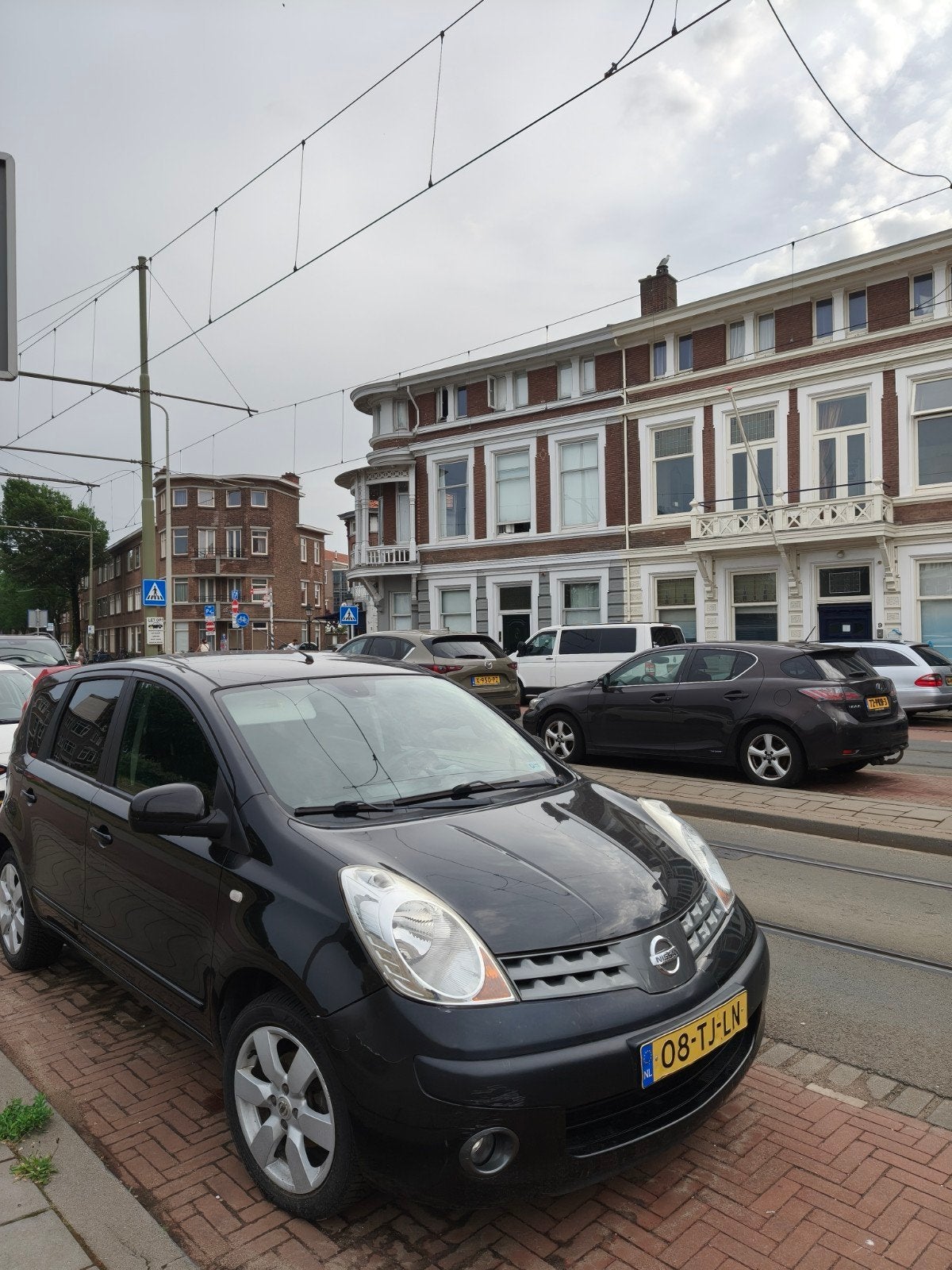 Nissan Note 1.6 16V 2006 Zwart, Auto's, Voorwielaandrijving, 15 km/l, 4 cilinders, Origineel Nederlands