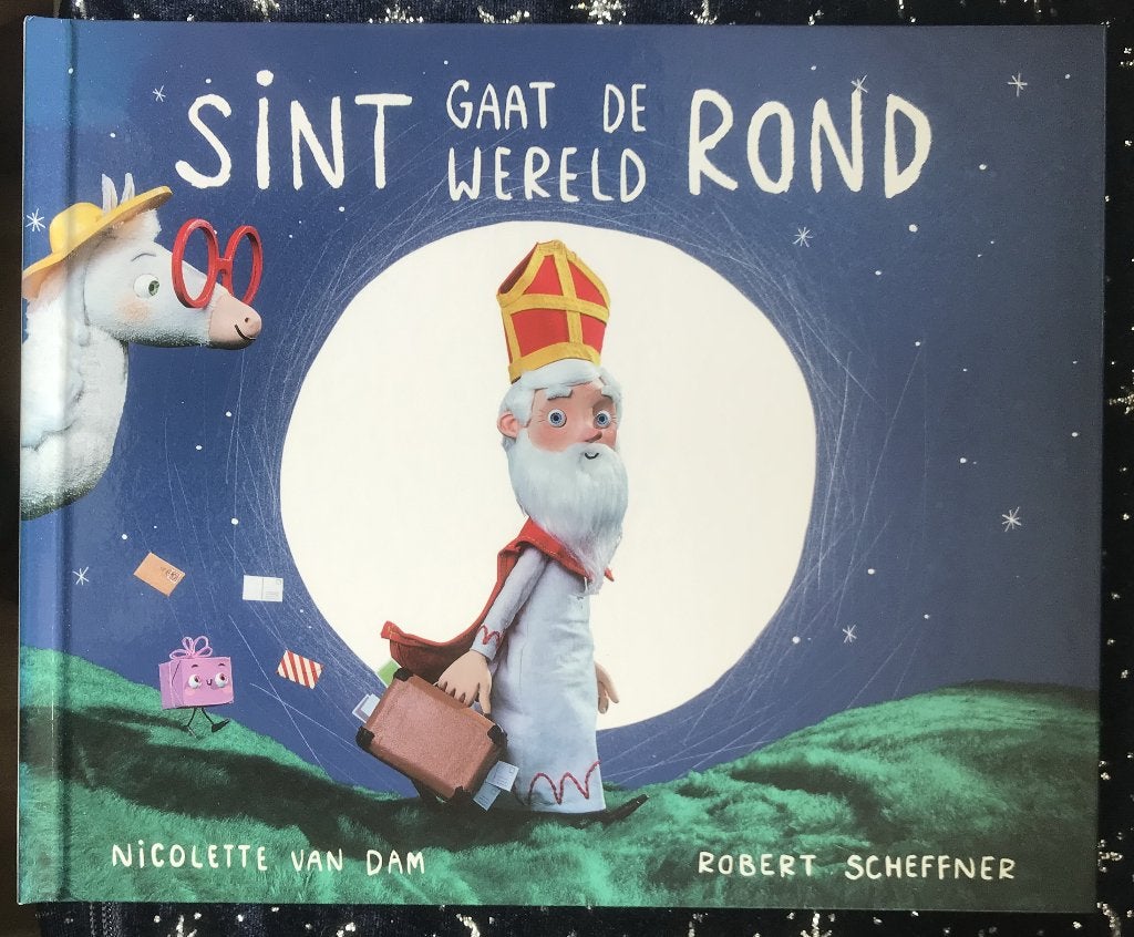 Sint gaat de wereld rond - Nicolette van Dam, Nicolette van Dam, Fictie algemeen, Ophalen of Verzenden, Zo goed als nieuw