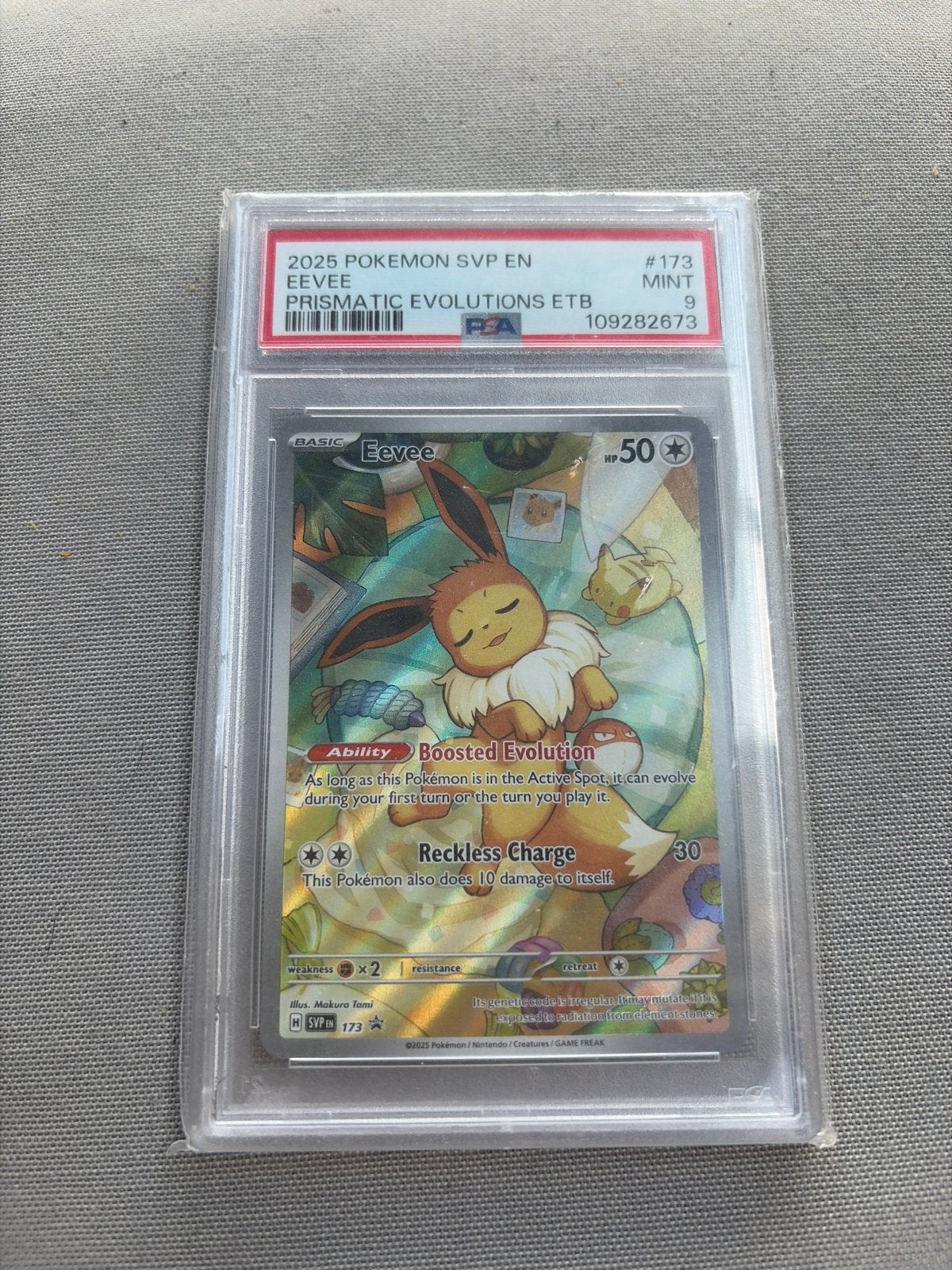 Pokémon Eevee Prismatic Evolutions ETB #173 PSA 9 Mint, Ophalen of Verzenden, Zo goed als nieuw, Losse kaart