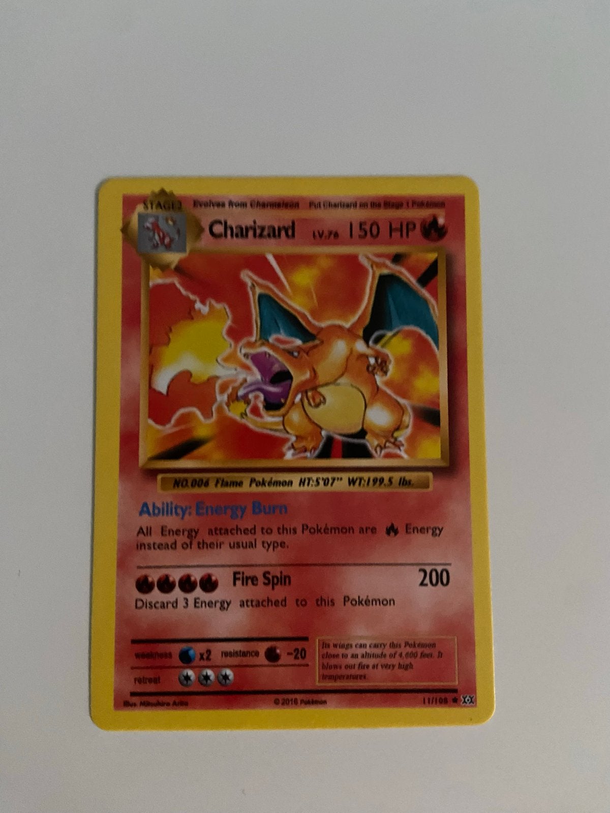 Charizard Pokémon kaart - Base Set Reprint 2016, Hobby en Vrije tijd, Verzamelkaartspellen | Pokémon, Ophalen of Verzenden, Zo goed als nieuw