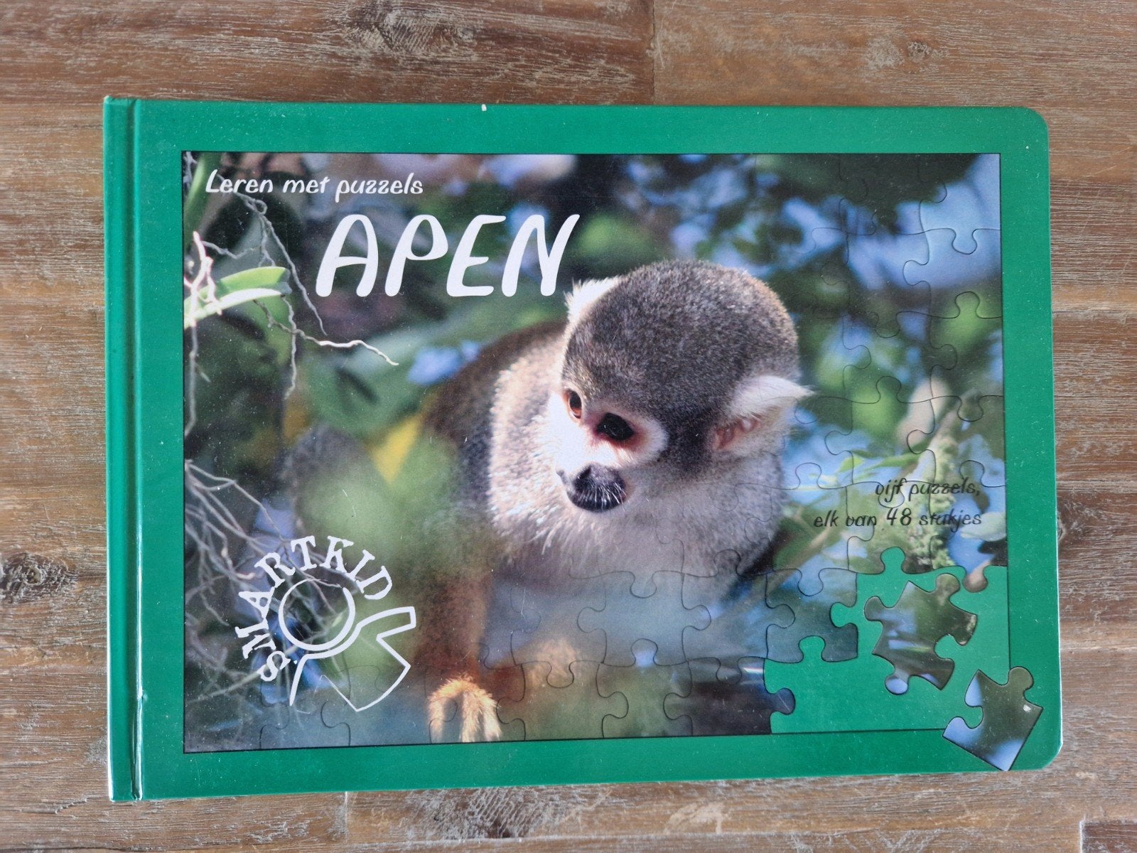 Boek met legpuzzels over apen, Ophalen, Minder dan 500 stukjes, Zo goed als nieuw, Puzzelboek