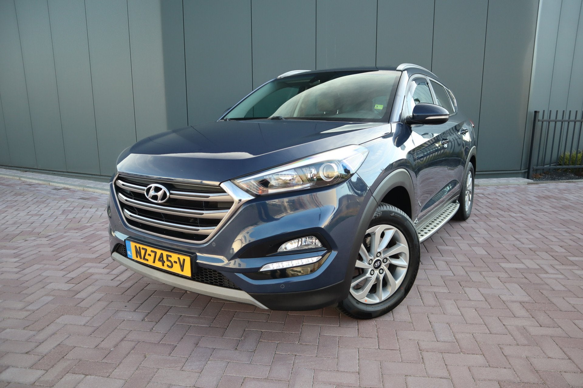 Hyundai Tucson 1.6 GDi Go! Lederen Comfort stoelen Camera Na, Auto's, Voorwielaandrijving, Gebruikt, 4 cilinders, Blauw