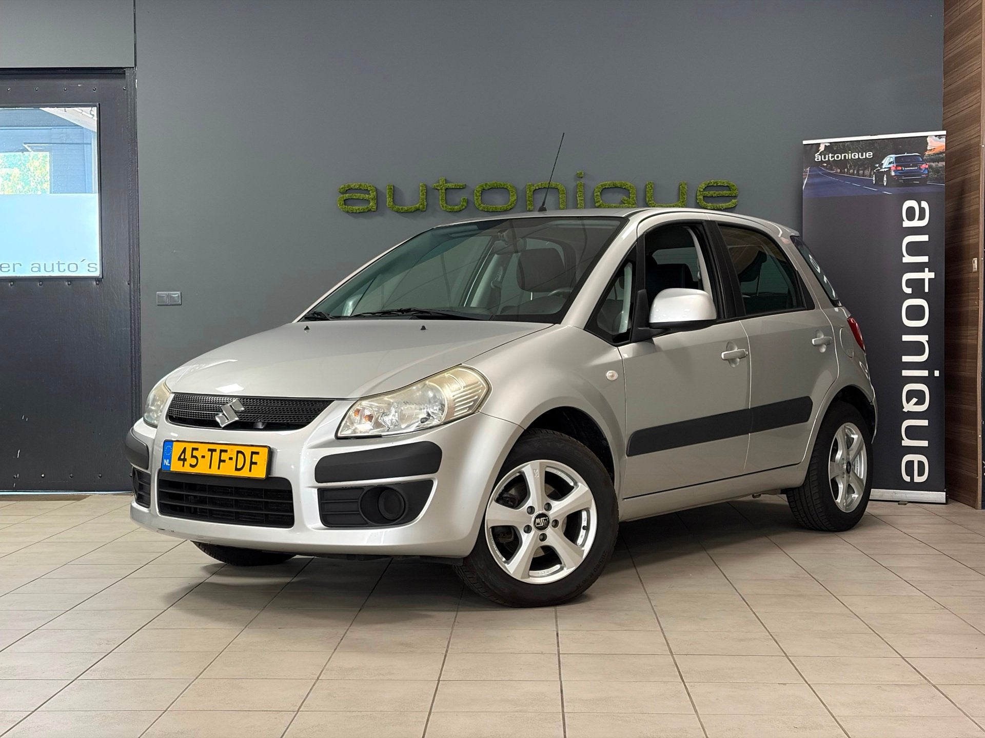 Suzuki SX4 1.6 Comfort airco/tr.haak, Auto's, Voorwielaandrijving, Dealer onderhouden, Gebruikt, Zwart