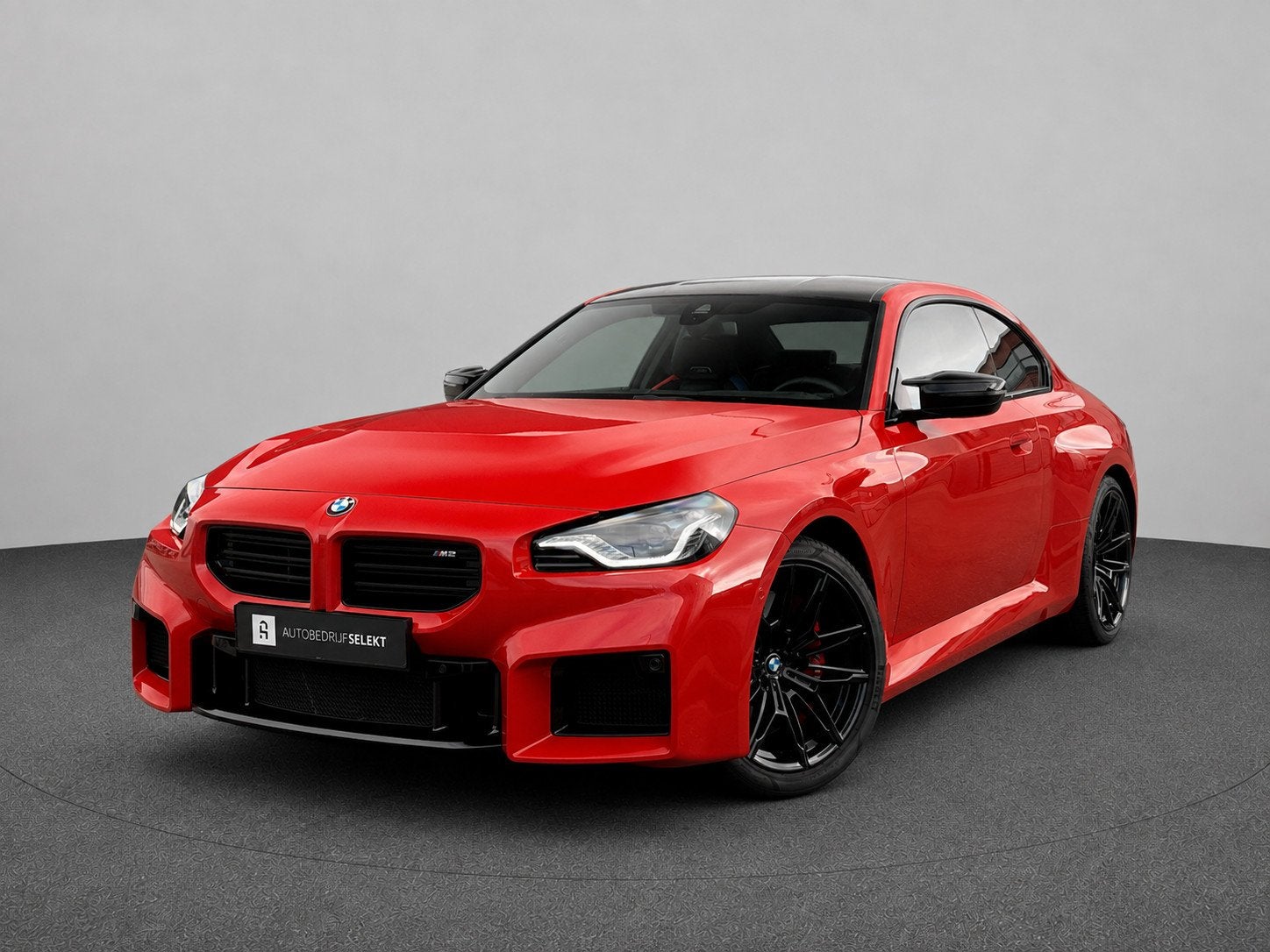 BMW 2-serie Coupé M2 | G87 | Toronto rood metallic | Carbon, Auto's, Automaat, Dealer onderhouden, Achterwielaandrijving, 2 stoelen
