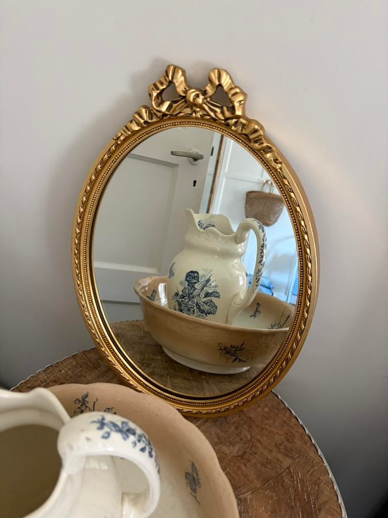 Brocante oude gouden strik spiegel( ovale spiegel), Ophalen of Verzenden