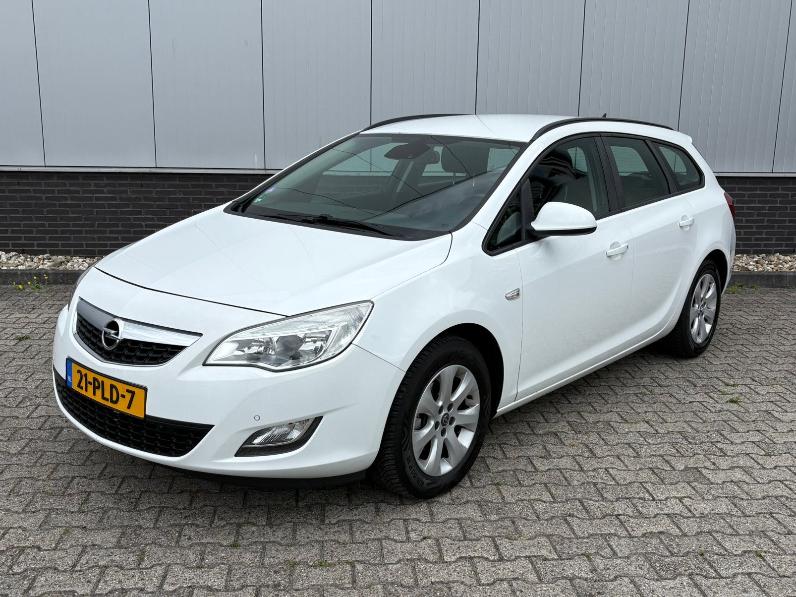 Opel Astra 1.4 Turbo Sports airco | cruise | trekhaak, Auto's, Voorwielaandrijving, Euro 5, Zwart, 4 cilinders