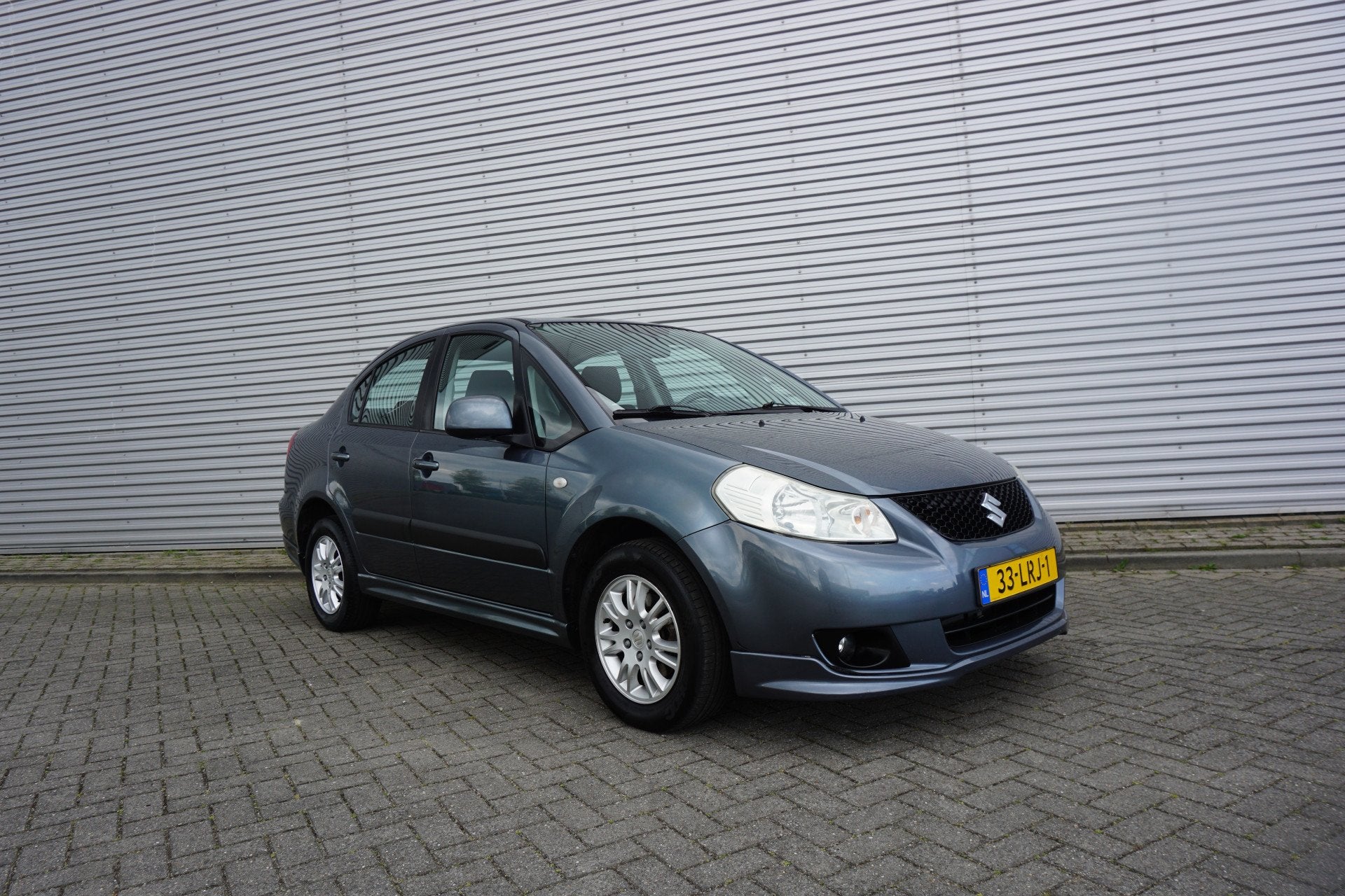 Suzuki SX4 1.6 Exclusive Airco / Elektr. ramen / Parkeersens, Auto's, Elektrische ramen, Gebruikt, 4 cilinders, 49 €/maand