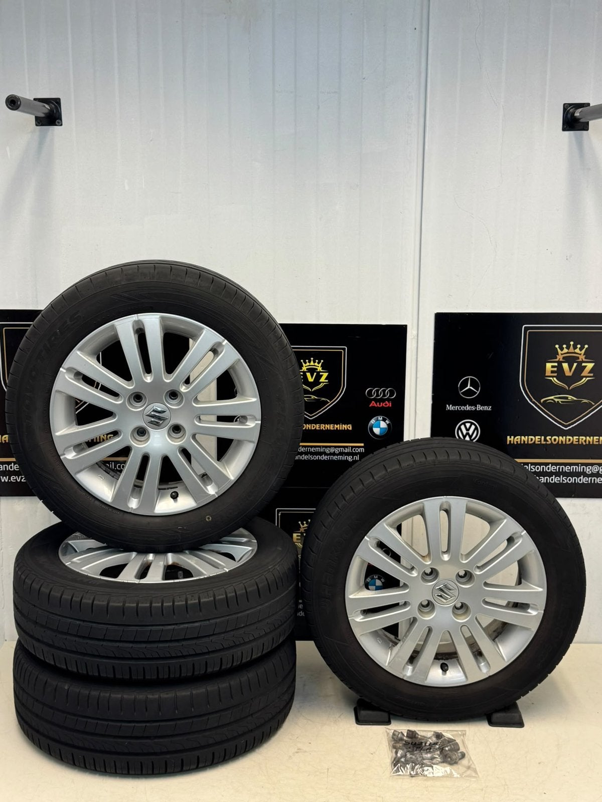Org. Suzuki Splash bj.2011 velgen set met zomerbanden 4x100, Auto-onderdelen, Gebruikt, 15 inch, Banden en Velgen, EVZ Handelsonderneming