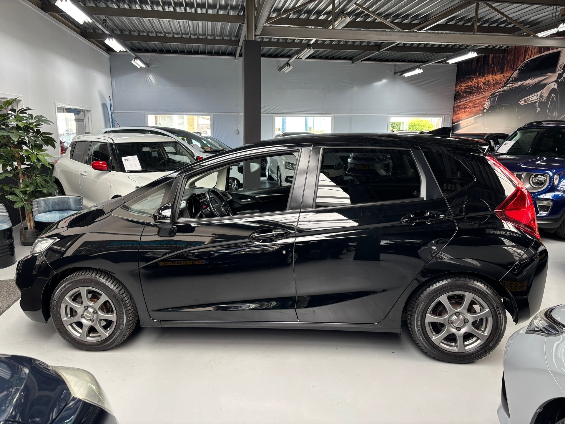 Honda JAZZ 1.3 i-VTEC Elegance / Camera / Navi / Stoelverwar, Voorwielaandrijving, Gebruikt, 4 cilinders, Met garantie (alle)