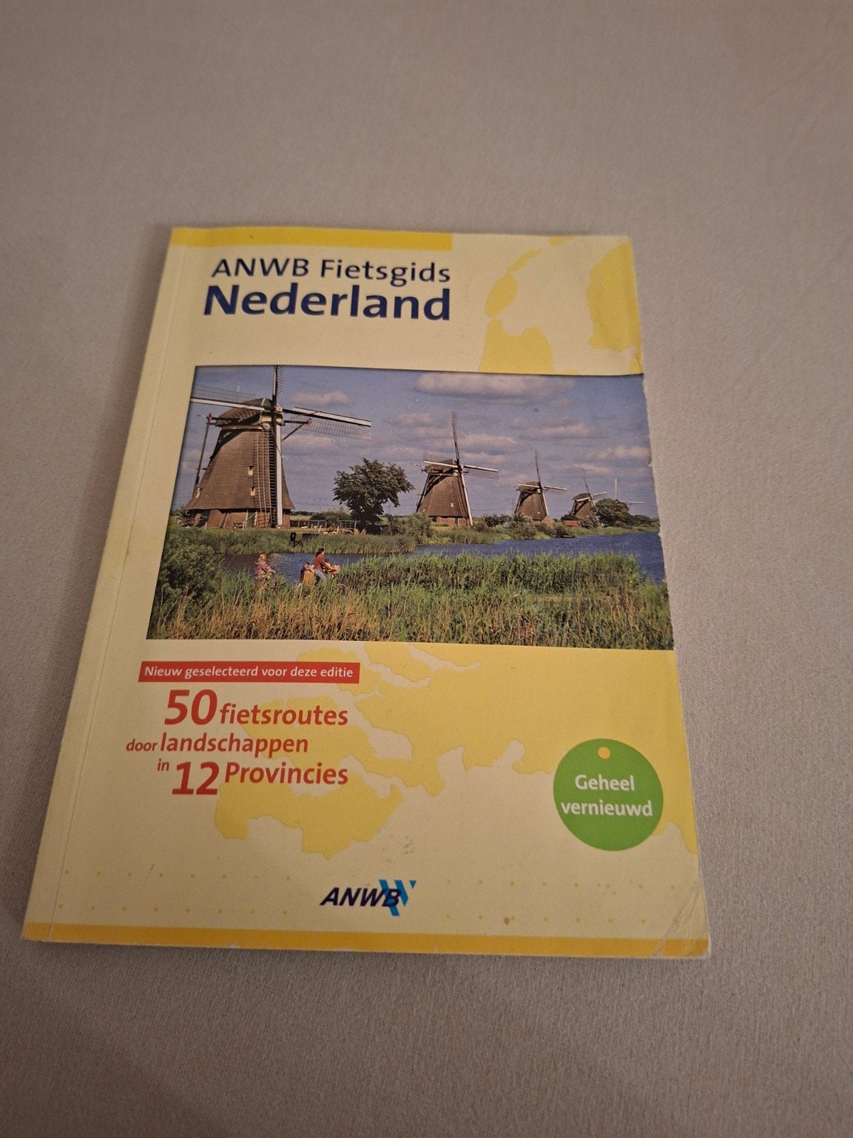anwb Fietsgids Nederland 50 fietsroutes door 12 provincies, Ophalen of Verzenden, Gelezen, Overige onderwerpen, ANWB