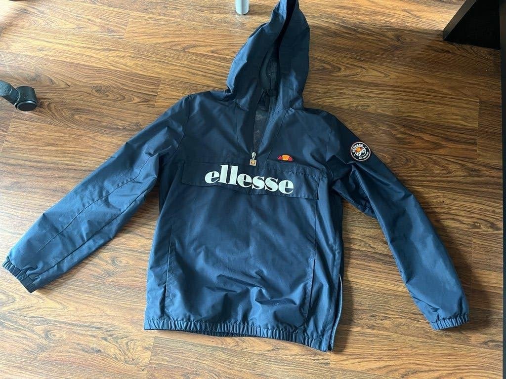 Ellesse wind jack blauw met rits en capuchon 158-164 13/14Y, Jongen of Meisje, Ophalen of Verzenden, Zo goed als nieuw, Jas
