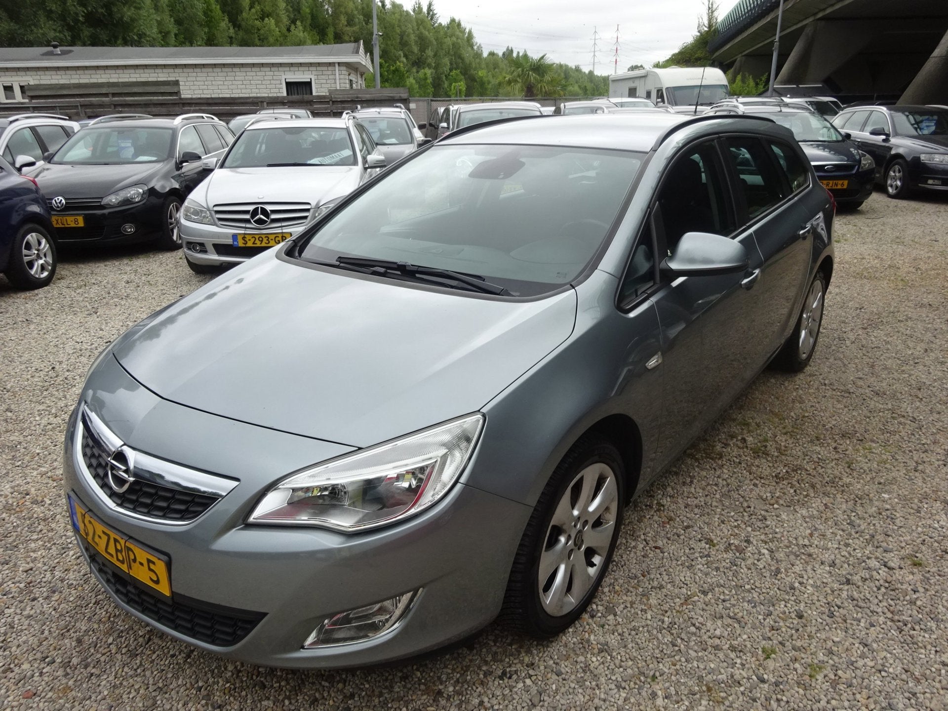Opel Astra Sports Tourer 1.4 Cosmo airco cruise control trek, Voorwielaandrijving, Euro 5, Gebruikt, 4 cilinders