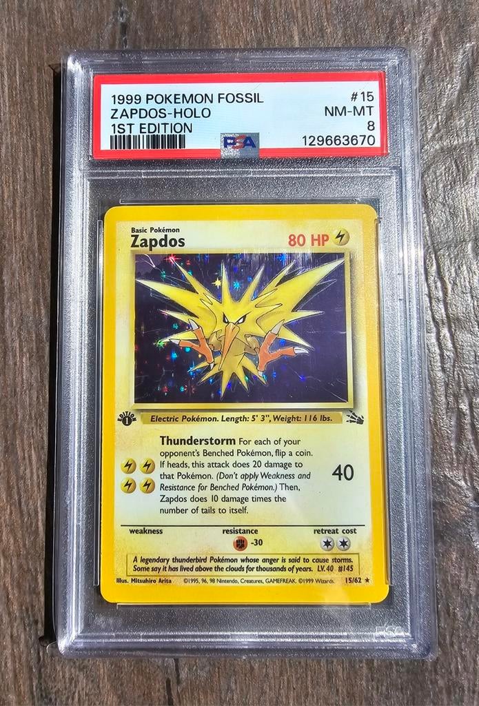 Zapdos 15/62 1st edition PSA 8 Fossil Set ⚡️, Ophalen of Verzenden, Nieuw, Losse kaart, Foil