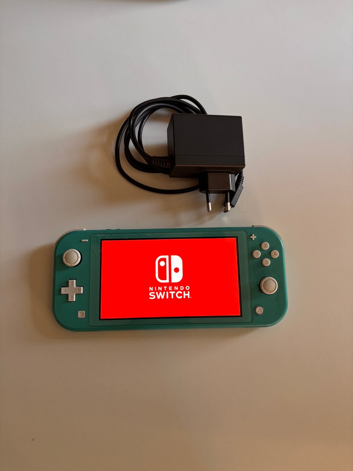 Nintenodo Switch Lite, turquoise en 5 games, Spelcomputers en Games, Ophalen, Turquoise, Zo goed als nieuw