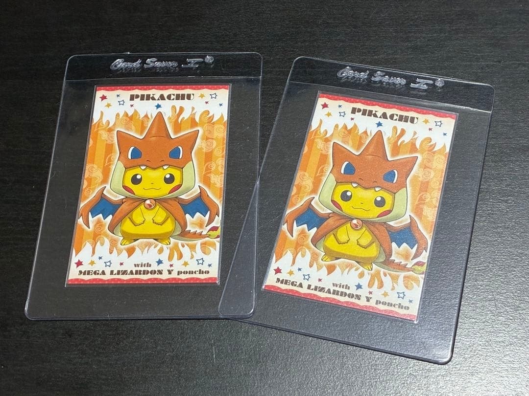 2x Mega Charizard Y Pikachu Poncho Business Cards MINT, Ophalen of Verzenden, Zo goed als nieuw, Meerdere kaarten