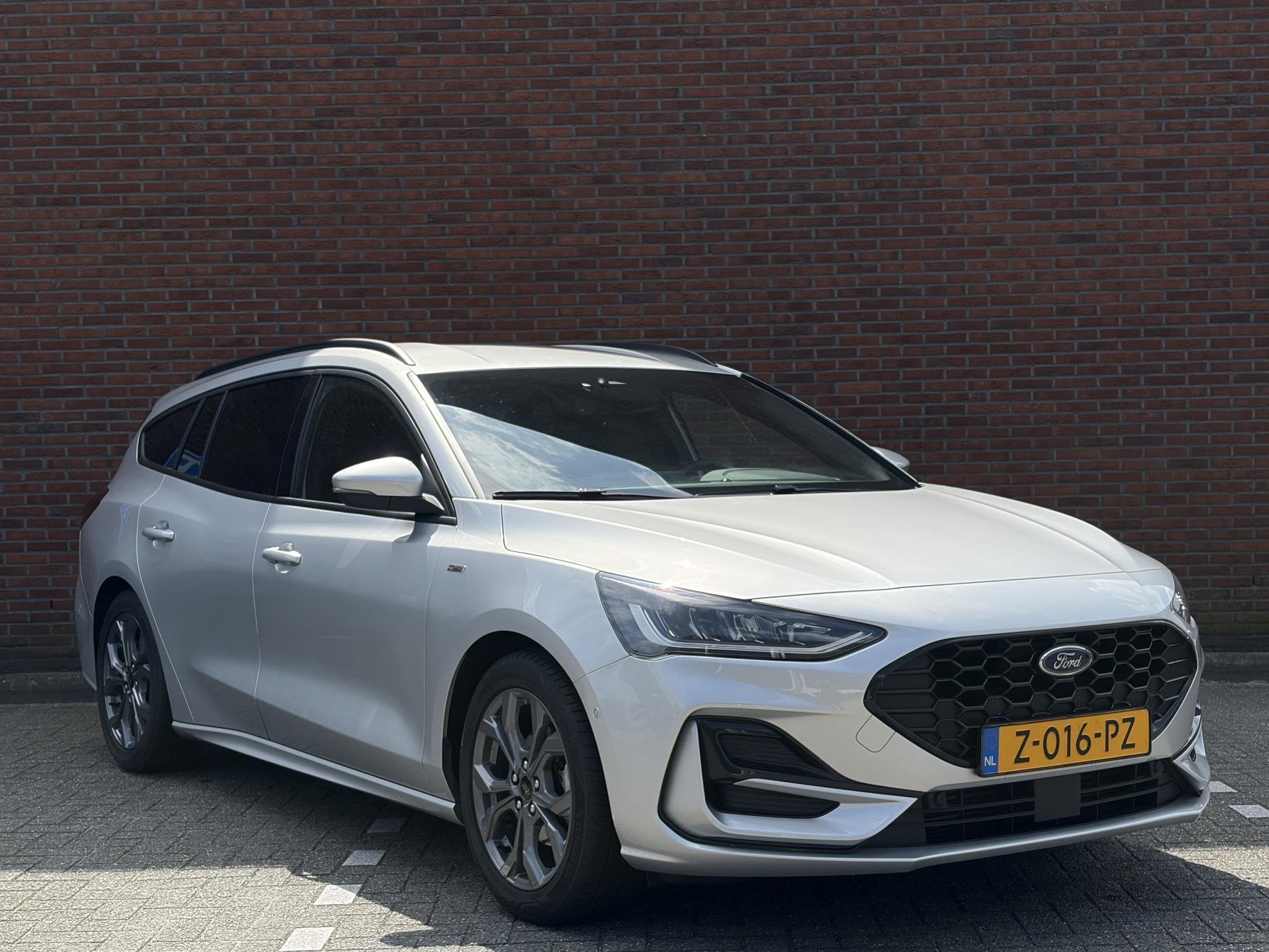 Ford Focus Wagon 1.0 EcoBoost Hybrid 125pk ST-Line I Achteru, Auto's, Stof, Gebruikt, Euro 6, Verwarmde buitenspiegels