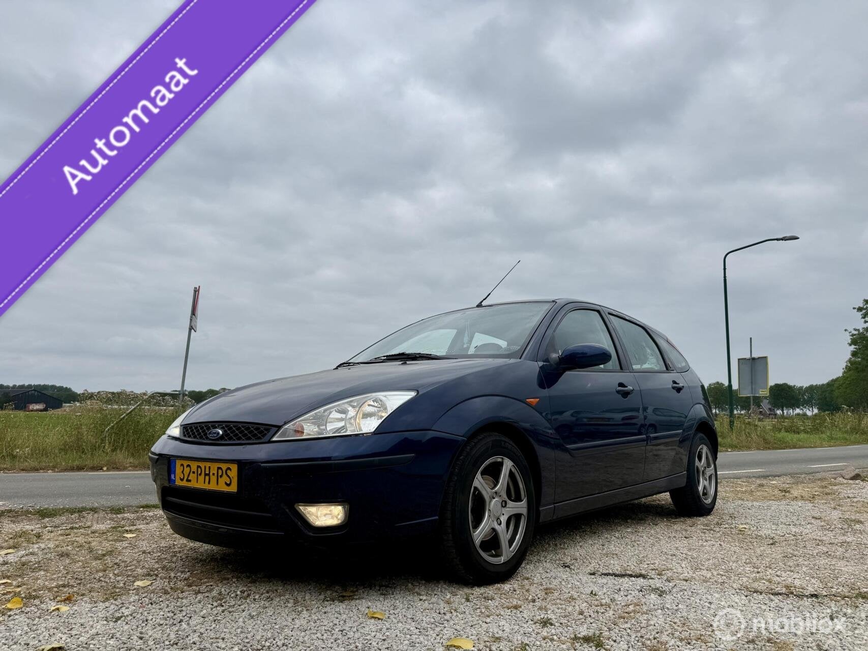 Ford Focus 1.6-16V Ghia, BJ 2004 Automaat, APK Juli 2027, Auto's, 1596 cc, Gebruikt, Blauw, 49 €/maand