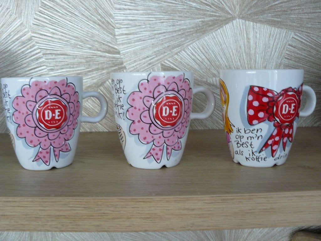 Drie Blond Amsterdam Cappuccino mok (Douwe Egberts)., Ophalen of Verzenden, Zo goed als nieuw, Kop(pen) en/of Schotel(s), Aardewerk