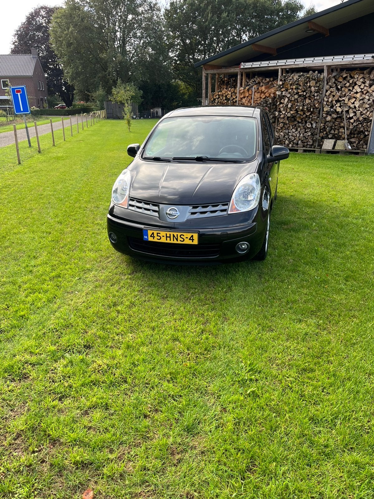 Nissan Note 1.6 16V AUT 2009 Zwart 49900 km, Auto's, Verwarmde buitenspiegels, 15 km/l, 750 kg, 4 cilinders
