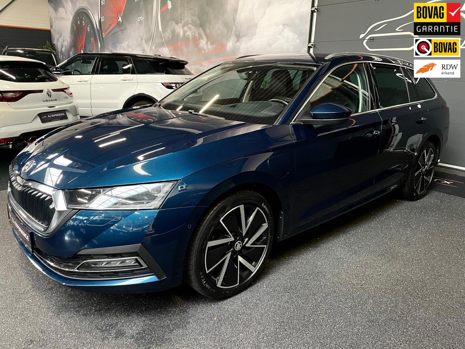Skoda Octavia Combi 1.4 TSI Style iV Hybride 204 PK APPLE CA, Auto's, Skoda, Gebruikt, Blauw, Geïmporteerd, 1500 kg