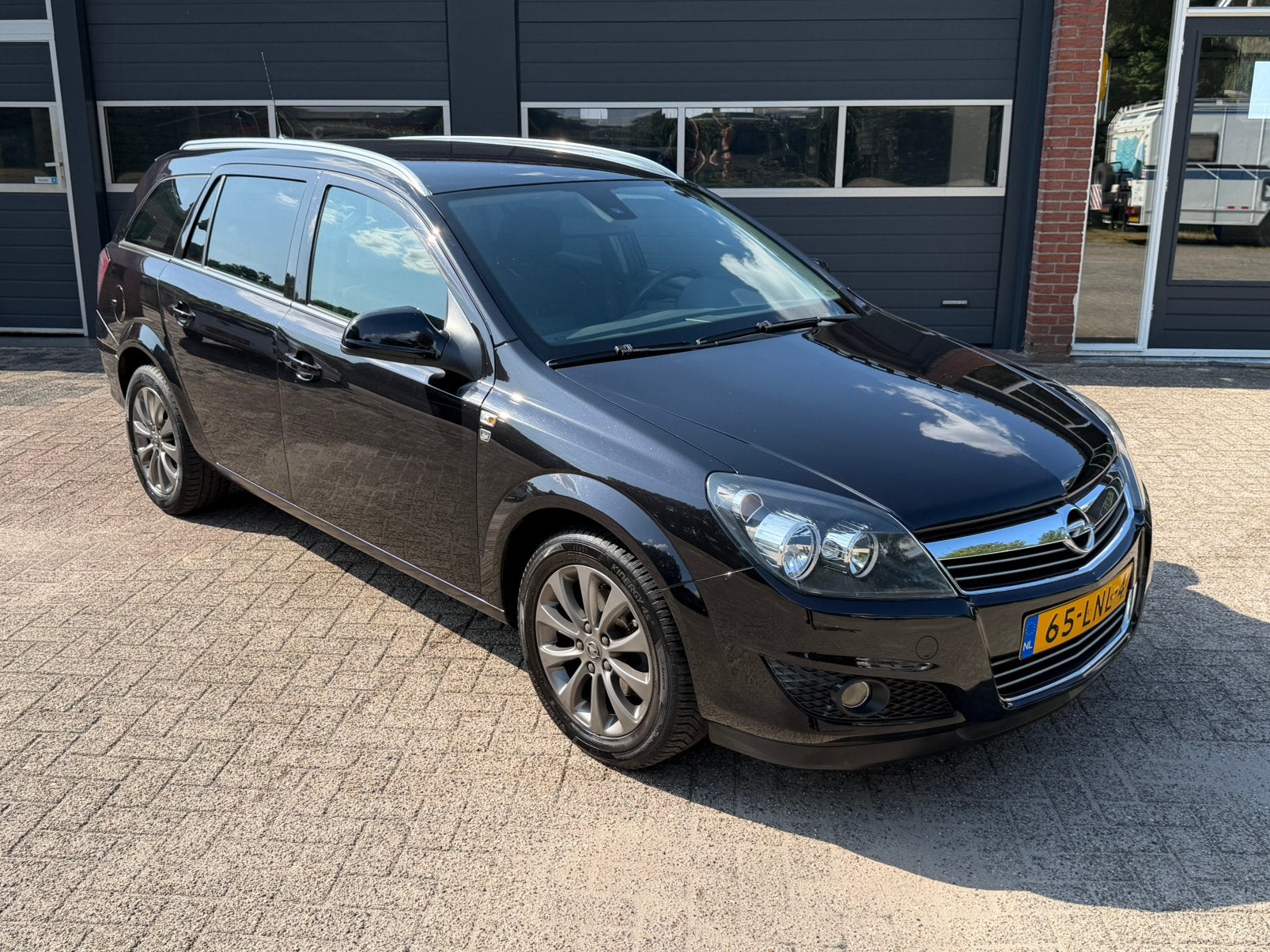 Opel Astra 1.6 16V 85KW St.wgn. 2010 111 EDITION|Trekhaak, Auto's, Voorwielaandrijving, Euro 5, Zwart, Zwart