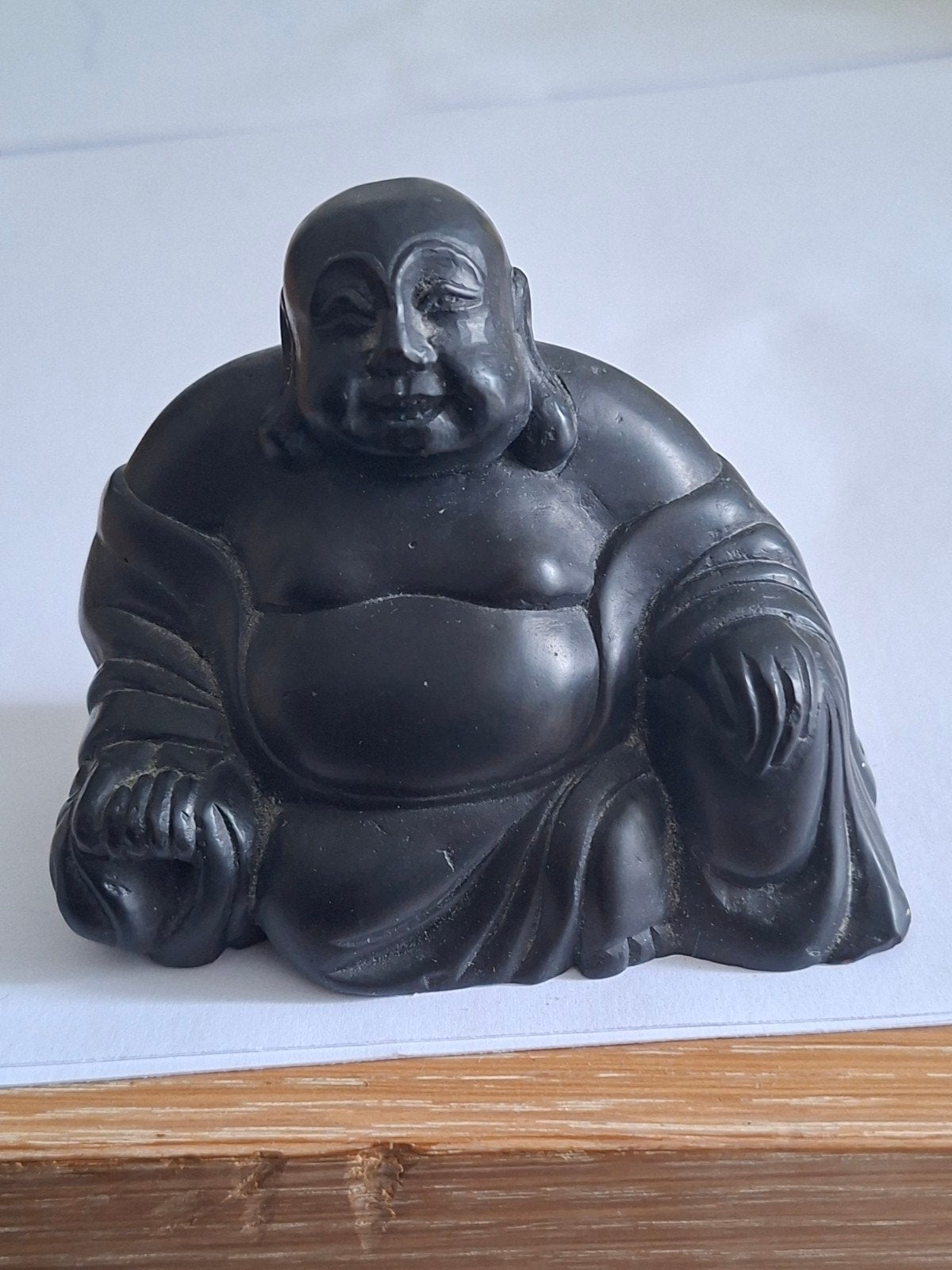 Lachende Boeddha een Budai, Ophalen