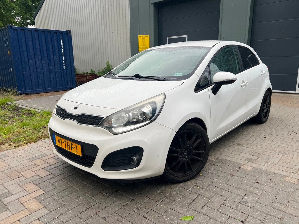 Kia Rio 1.2 CVVT Super Pack Airco/Cruise, Auto's, Euro 5, 4 cilinders, Wit, Origineel Nederlands