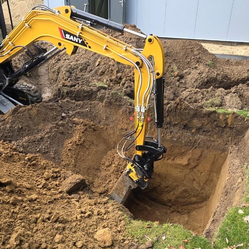 Minigraver met machinist tuinaanleg en onderhoud bestrating, Garantie, Tuinontwerp